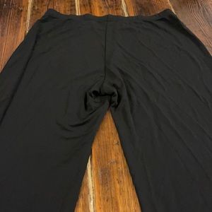 These are beautiful, like new, fit like a large.  Black, dressy, wide leg.